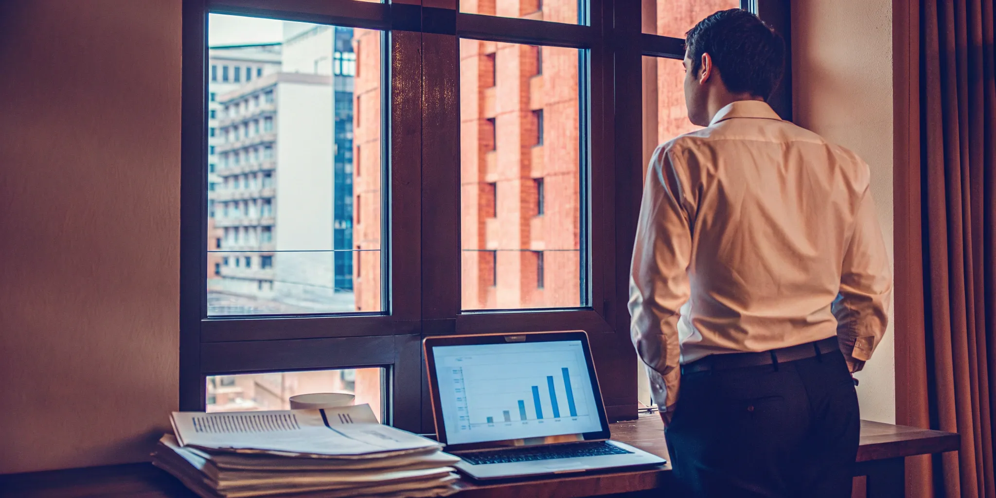 Level-funded health plan graph on a laptop.